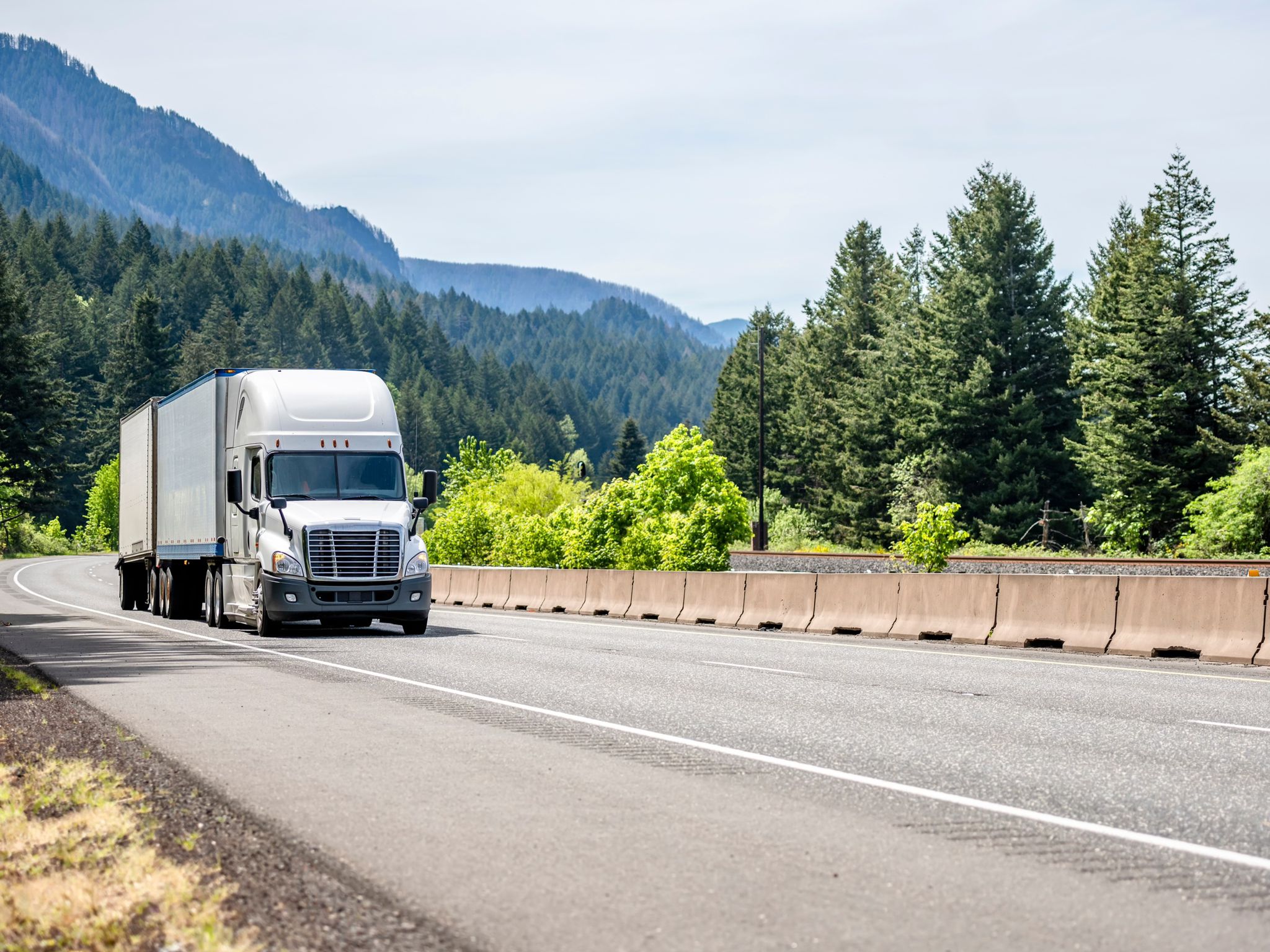Freight truck from the Docceleration carrier network on a mountain highway